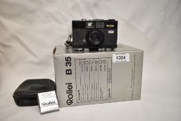 A Rollei B35 camera with Rollei _UV collapsable lens in original box