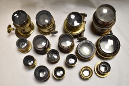 A box of various brass lenses