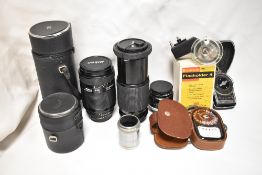 A selection of lenses, light metres etc. A Sunagor CDX 80-200 f4,5 lens, a Nikon AF Nikkor 70-