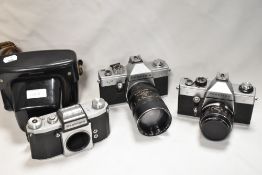 Three Praktica cameras. A Praktica LLC camera with Meyer-Optik Gorlitz Oreston 1,8/50 lens. A