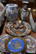 A collection of Oriental style ceramics including display platter, display plates and vase etc.