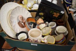 A box containing a selection of cabinet items including Wedgwood and Wade display plates, Crown