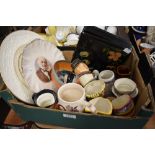 A box containing a selection of cabinet items including Wedgwood and Wade display plates, Crown