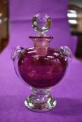 A vintage David Wallace studio art glass scent bottle with cranberry body