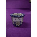 A small Chinese blue and white ware pot having lattice pierced sides on six footed base