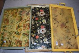 Three painted wooden tea trays with decoupage decoration.`