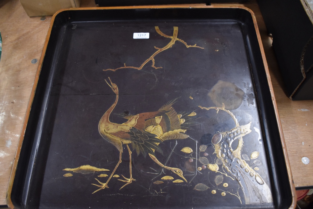 A large late 19th century Japanese lacquer serving tray decorated with stalks and landscape