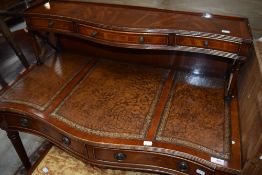 A reproduction leather top desk