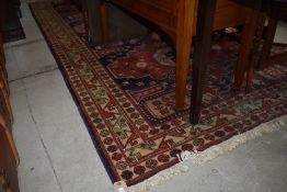 A vintage carpet sqaure, approx. 344 x 167cm