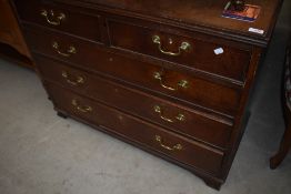 A period oak chest of two over three drawers, having brass drop handles, width approx. 104cm