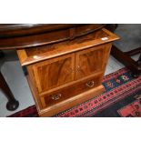 A nice quality reproduction yew wood TV cabinet having faux drawer fronts