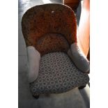 A Victorian spoon back easy chair