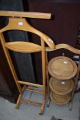 A vintage valet and stained frame folding cake stand