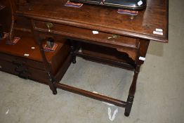 A 19th Century oak side table having frieze drawer