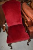 A Queen Anne style mahogany frame high back armchair having burgundy dralon upholstery