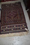 A traditional Persian or similar rug, approx. 135 x 88cm