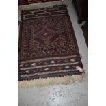 A traditional Persian or similar rug, approx. 135 x 88cm