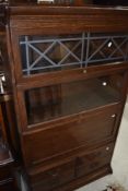 A four tier oak stacking bookcase in the Globe Wernicke style