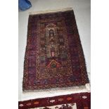 A traditional Persian or similar rug, approx. 116 x 75cm