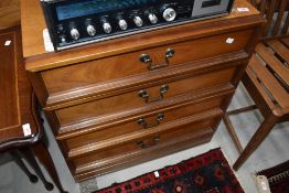 A vintage teak and laminate low chest of drawers