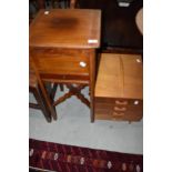 An early 20th Century mahogany sewing table and a vintage ply sewing box (af)