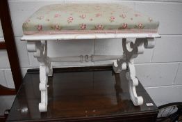 A painted scroll frame dressing table stool