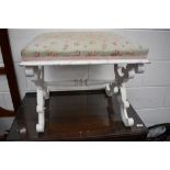 A painted scroll frame dressing table stool