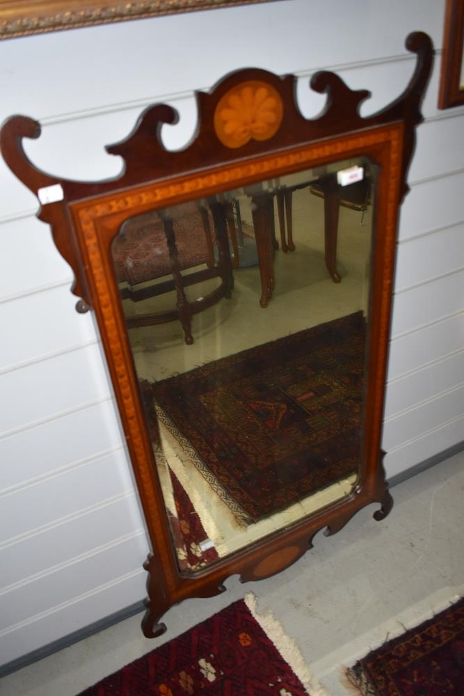 An Edwardian Chippendale style wall mirror