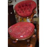 A Victorian mahogany frame low seat nursing chair having button back