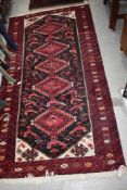 A traditional Persian or similar rug, approx. 190 x 96cm