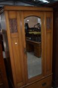 A Victorian satinwood wardrobe