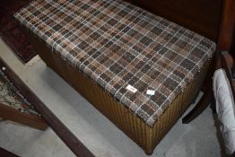A vintage Lloyd Loom bedding box