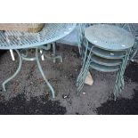 A modern metal garden table and set of four chairs