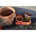 A selection of terracotta planters including large one