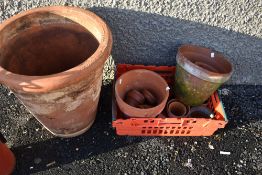 A selection of terracotta planters including large one
