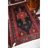 A Persian style rug, approx. 210 x 110cm