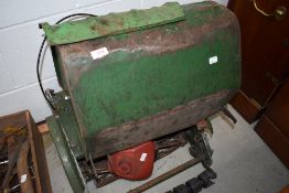 A selection of vintage lawnmower parts, including Suffolk Punch