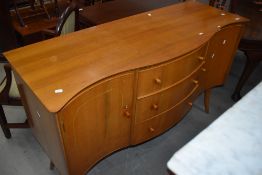 A vintage serpentine front sideboard