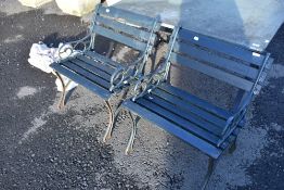 A pair of cast ended slatted garden seats