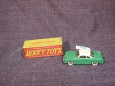 A Dinky diecast, 187 Volkswagen Karmann Ghia Coupe in green with cream roof, in original box