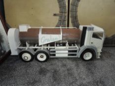 A wooden and plastic hand built scale model of a 6 wheeled tanker, Graham's