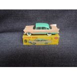 A Dinky diecast, 178 Plymouth Plaza, Pink & Green in original correct spot box