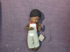 A Pedigree doll designed by Nora P. Hill, with felt face, painted eyes, velvet body wearing original