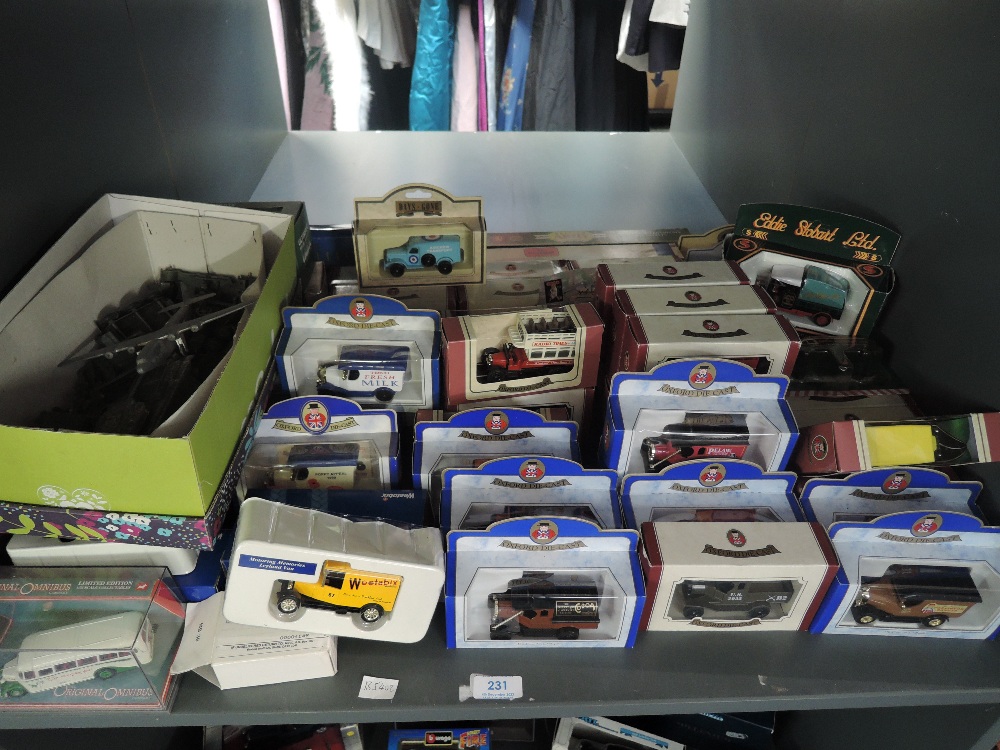 A shelf of mixed vintage diecasts including playworn Dinky Military, modern Oxford and similar boxed