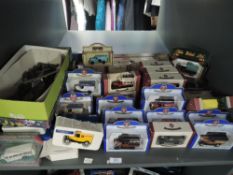 A shelf of mixed vintage diecasts including playworn Dinky Military, modern Oxford and similar boxed