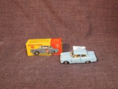 A Dinky diecast, 139 Ford Consul Cortina in light blue with cream interior, opening side doors and