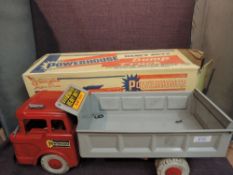 A Marx Magic Marxie Toy tin plate and friction driven Powerhouse Dump Truck having red cab with