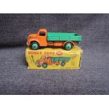 A Dinky diecast, 414 Dodge Rear Tipping Wagon, Orange & Green, in original correct spot box