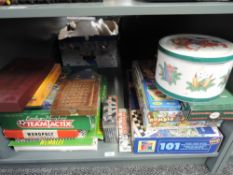 A shelf of mixed vintage Games and Toys including Team Tactix, Wembley, Waddingtons Grand Prix, Four