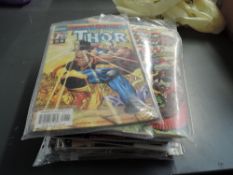 A collection of Marvel & DC Comics including 2004 Smallville, 2010 Wolverine & Deadpool, earlier 203